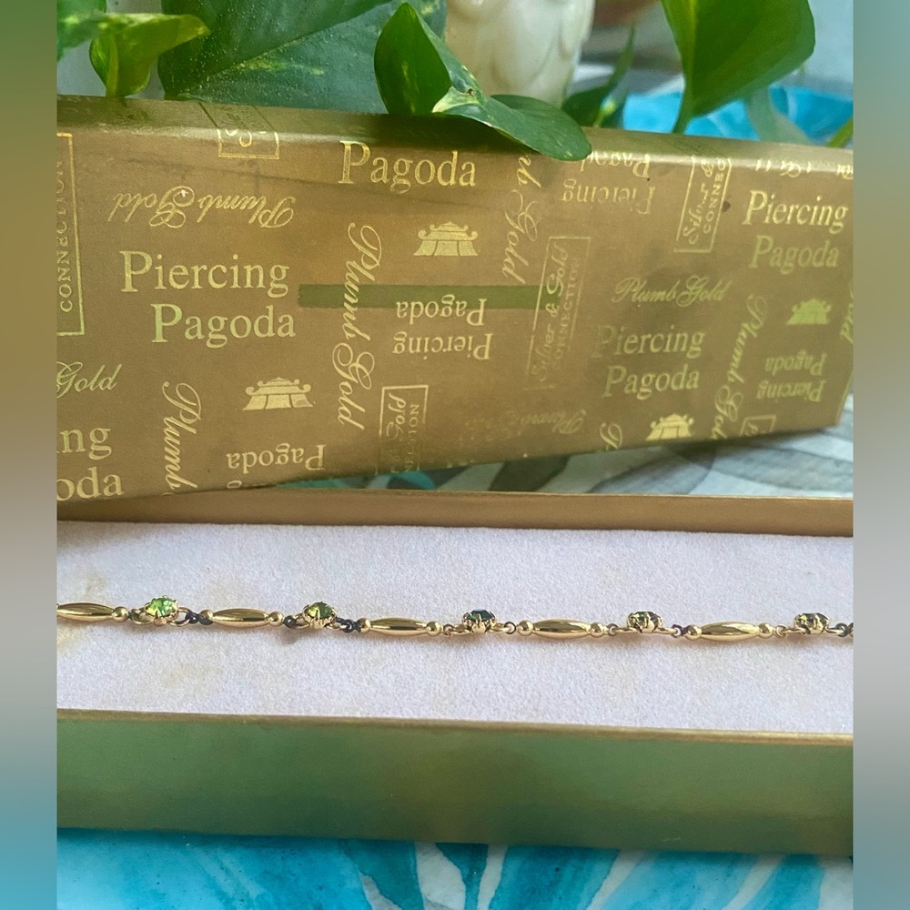 Vintage• Piercing Pagoda Tennis Bracelet • Gold over Brass with Green Gemstones